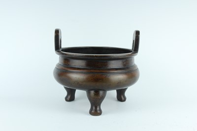 Lot 71 - A large Chinese bronze censer with two handles,...