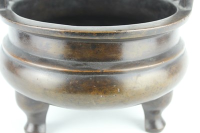Lot 71 - A large Chinese bronze censer with two handles,...