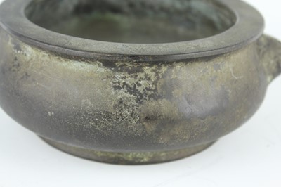 Lot 74 - A Chinese bronze censer with two mask handles,...
