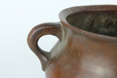 Lot 73 - A Chinese bronze censer with two loop handles,...