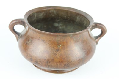 Lot 73 - A Chinese bronze censer with two loop handles,...