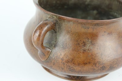 Lot 73 - A Chinese bronze censer with two loop handles,...