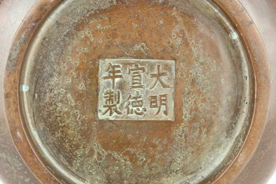 Lot 73 - A Chinese bronze censer with two loop handles,...