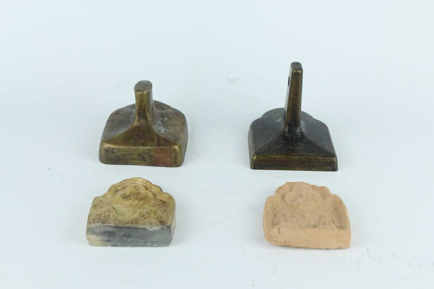 Lot 62 - Two Chinese bronze moulds together with two...