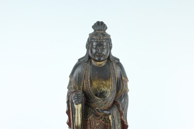 Lot 44 - A Chinese lacquered wooden figure of a deity,...