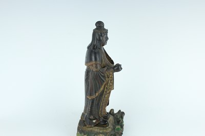 Lot 44 - A Chinese lacquered wooden figure of a deity,...