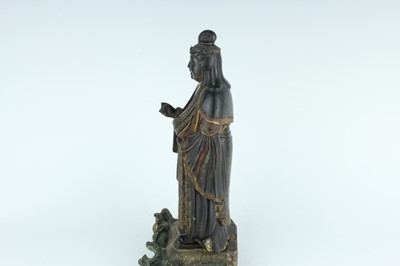 Lot 44 - A Chinese lacquered wooden figure of a deity,...