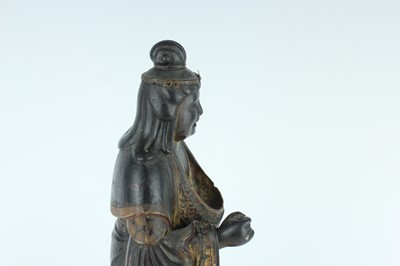Lot 44 - A Chinese lacquered wooden figure of a deity,...