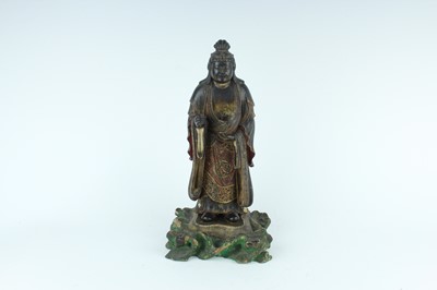 Lot 44 - A Chinese lacquered wooden figure of a deity,...