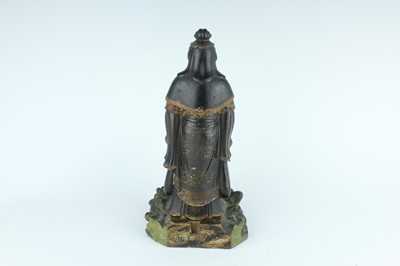 Lot 44 - A Chinese lacquered wooden figure of a deity,...