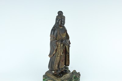 Lot 44 - A Chinese lacquered wooden figure of a deity,...