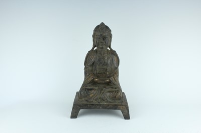 Lot 65 - A Chinese bronze figure of a seated...