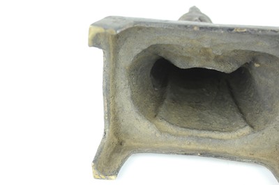 Lot 65 - A Chinese bronze figure of a seated...