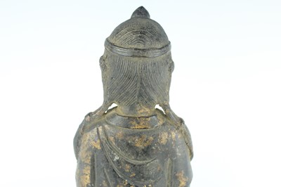 Lot 65 - A Chinese bronze figure of a seated...