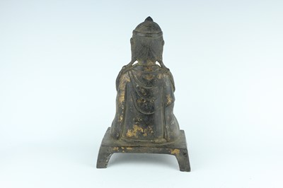 Lot 65 - A Chinese bronze figure of a seated...