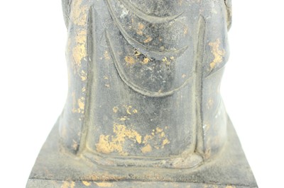 Lot 65 - A Chinese bronze figure of a seated...