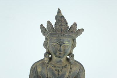 Lot 67 - A Chinese bronze figure of Buddha seated on a...