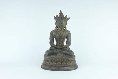 Lot 67 - A Chinese bronze figure of Buddha seated on a...