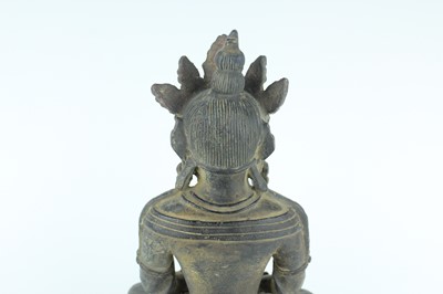 Lot 67 - A Chinese bronze figure of Buddha seated on a...
