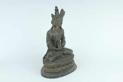 Lot 67 - A Chinese bronze figure of Buddha seated on a...