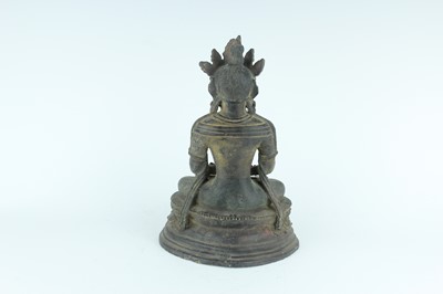 Lot 67 - A Chinese bronze figure of Buddha seated on a...