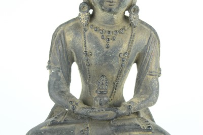 Lot 67 - A Chinese bronze figure of Buddha seated on a...