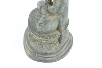 Lot 67 - A Chinese bronze figure of Buddha seated on a...