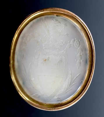 Lot 363 - A yellow metal fob set with a 25 x 21mm oval...