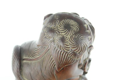 Lot 43 - A Chinese hardwood carved lion figure, Qing...