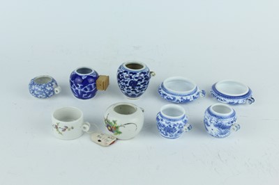 Lot 26 - A group of nine Chinese porcelain bird feeders,...
