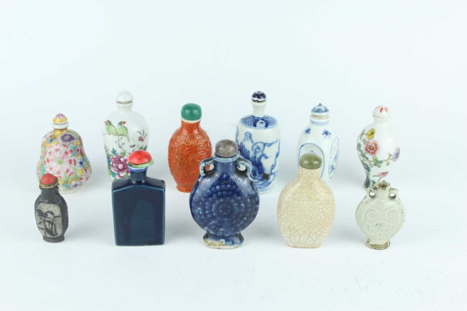 Lot 27 - A group of eleven Chinese porcelain snuff...