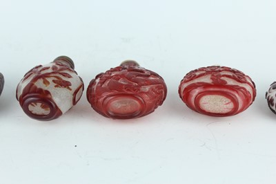Lot 30 - A group of eight Chinese glass snuff bottles,...