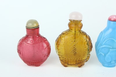 Lot 29 - A group of seven Chinese glass snuff bottles,...