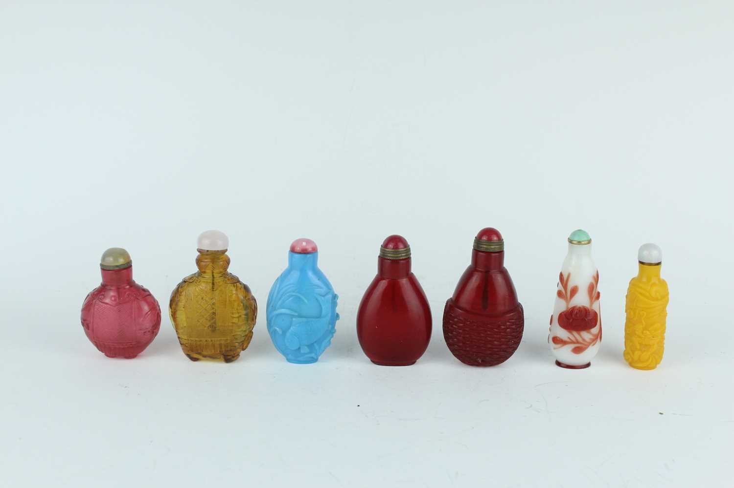 Lot 29 - A group of seven Chinese glass snuff bottles,...