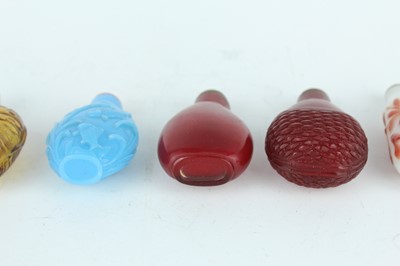 Lot 29 - A group of seven Chinese glass snuff bottles,...