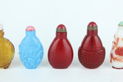 Lot 29 - A group of seven Chinese glass snuff bottles,...