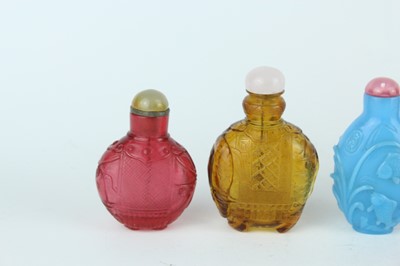 Lot 29 - A group of seven Chinese glass snuff bottles,...