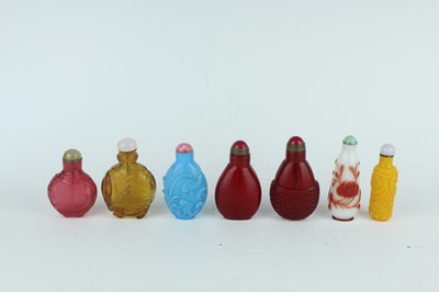 Lot 29 - A group of seven Chinese glass snuff bottles,...