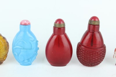 Lot 29 - A group of seven Chinese glass snuff bottles,...