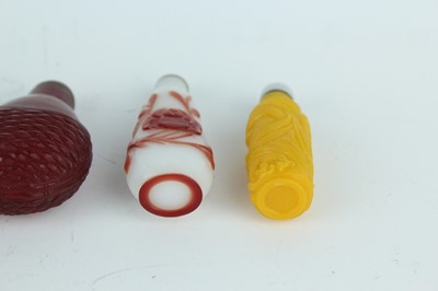 Lot 29 - A group of seven Chinese glass snuff bottles,...