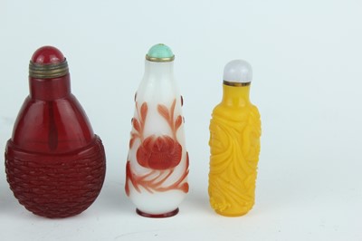 Lot 29 - A group of seven Chinese glass snuff bottles,...