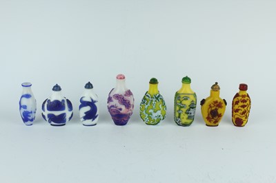 Lot 31 - A group of eight Chinese glass snuff bottles,...