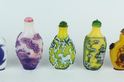 Lot 31 - A group of eight Chinese glass snuff bottles,...