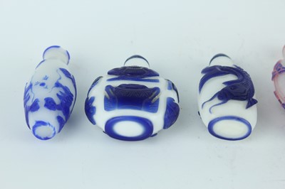 Lot 31 - A group of eight Chinese glass snuff bottles,...
