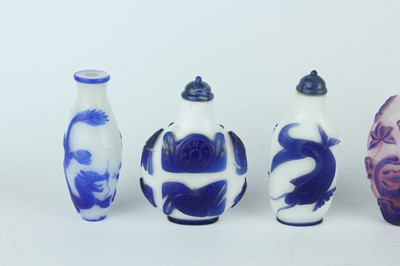 Lot 31 - A group of eight Chinese glass snuff bottles,...