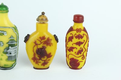 Lot 31 - A group of eight Chinese glass snuff bottles,...
