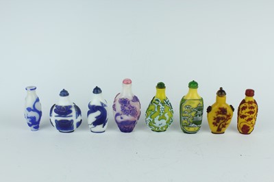 Lot 31 - A group of eight Chinese glass snuff bottles,...