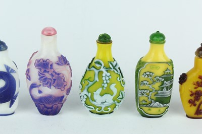 Lot 31 - A group of eight Chinese glass snuff bottles,...