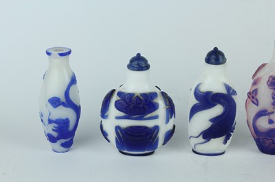 Lot 31 - A group of eight Chinese glass snuff bottles,...