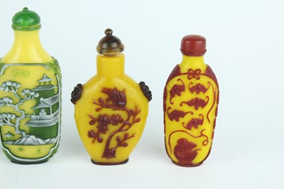 Lot 31 - A group of eight Chinese glass snuff bottles,...